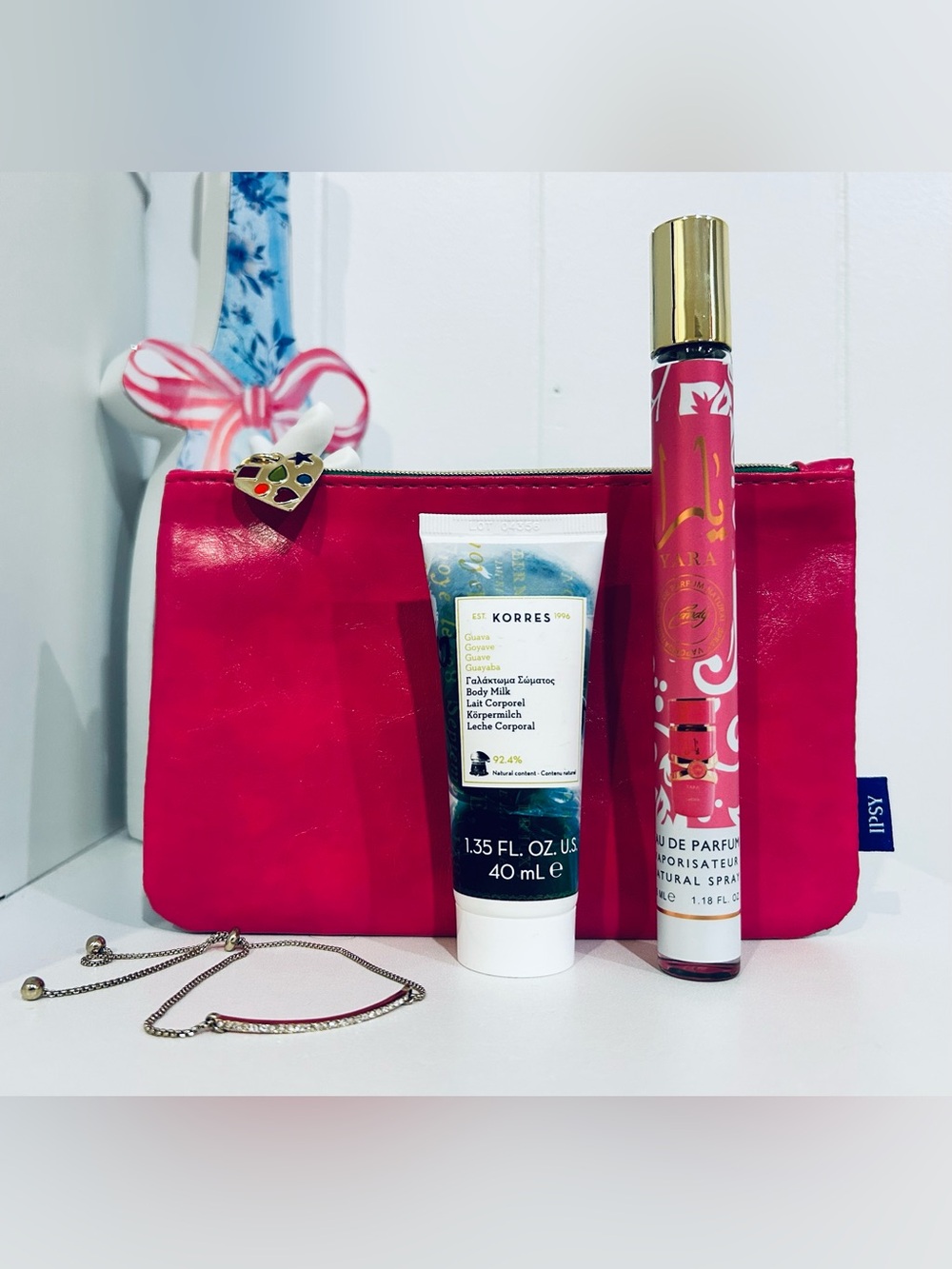 Hot Pink Cosmetic Bag with Korres Body Milk, Candy Yara and Plunder Bracelet
